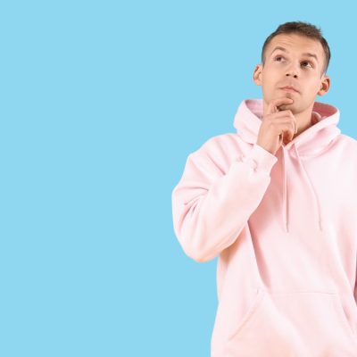Wondering,Young,Man,On,Blue,Background
